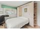 Guest bedroom with a Murphy bed and built-in shelving at 4714 Potomac Cir, Bradenton, FL 34210