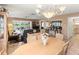 Dining area with chandelier and view to living room at 4714 Potomac Cir, Bradenton, FL 34210