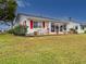 Exterior view of home with patio and lawn at 4714 Potomac Cir, Bradenton, FL 34210