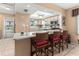 Kitchen with breakfast bar, stainless steel appliances, and light wood cabinets at 4714 Potomac Cir, Bradenton, FL 34210