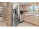 Stainless steel refrigerator in well-lit kitchen at 4714 Potomac Cir, Bradenton, FL 34210