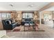 Relaxing living room with leather sofas and a view to the patio at 4714 Potomac Cir, Bradenton, FL 34210