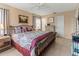 Large bedroom with king-size bed and tiled floors at 4714 Potomac Cir, Bradenton, FL 34210