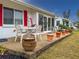 Outdoor patio with table, chairs, and potted plants at 4714 Potomac Cir, Bradenton, FL 34210