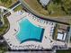 Aerial view of resort-style pool with surrounding lounge chairs at 4714 Potomac Cir, Bradenton, FL 34210