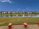 Community canal view with grassy areas and buildings at 4714 Potomac Cir, Bradenton, FL 34210