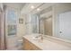 Clean bathroom with a shower/tub combo and light wood vanity at 4821 Hanging Moss Ln, Sarasota, FL 34238