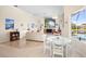 Bright dining area with white table and chairs, near living room at 4821 Hanging Moss Ln, Sarasota, FL 34238