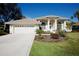 One-story home with attached garage and manicured lawn at 4821 Hanging Moss Ln, Sarasota, FL 34238