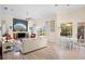 Open living and dining area with light wood floors at 4821 Hanging Moss Ln, Sarasota, FL 34238