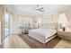 Main bedroom with light wood furniture and access to the pool at 4821 Hanging Moss Ln, Sarasota, FL 34238