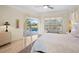 Main bedroom with sliding doors leading to the pool area at 4821 Hanging Moss Ln, Sarasota, FL 34238