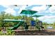 Community playground with shaded play structures and slide at 4821 Hanging Moss Ln, Sarasota, FL 34238