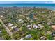 Aerial view of waterfront home with private backyard and canal access at 4857 Primrose Path, Sarasota, FL 34242