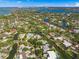 Wide aerial view of waterfront homes and canals at 4857 Primrose Path, Sarasota, FL 34242