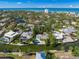 Aerial showing neighborhood, waterfront homes, and ocean at 4857 Primrose Path, Sarasota, FL 34242