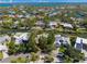 Aerial view highlighting a home nestled in a quiet, tree-lined neighborhood at 4857 Primrose Path, Sarasota, FL 34242