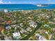 Bird's-eye view showcasing a home's waterfront location and lush surroundings at 4857 Primrose Path, Sarasota, FL 34242