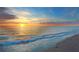 Scenic sunset over ocean waves on the beach at 4857 Primrose Path, Sarasota, FL 34242