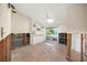 Bedroom with built-in shelving and hardwood floors, currently being renovated at 4857 Primrose Path, Sarasota, FL 34242