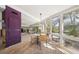 Bright dining area with hardwood floors and water views at 4857 Primrose Path, Sarasota, FL 34242