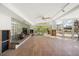 Large living room with hardwood floors and glass block fireplace at 4857 Primrose Path, Sarasota, FL 34242