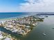 Wide aerial showcasing waterfront property and surrounding neighborhood at 512 Bayview Pl, Anna Maria, FL 34216