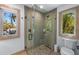 Spa-like bathroom with a walk-in shower and pebble floor at 512 Bayview Pl, Anna Maria, FL 34216