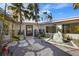 Relaxing courtyard with stone pathway and water feature at 512 Bayview Pl, Anna Maria, FL 34216