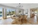 Bright dining room with water views and stylish wicker chairs at 512 Bayview Pl, Anna Maria, FL 34216