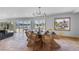 Bright dining room with water views and wicker chairs at 512 Bayview Pl, Anna Maria, FL 34216