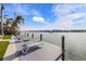 Spacious dock with lounge chairs overlooking the water at 512 Bayview Pl, Anna Maria, FL 34216