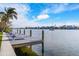 Relaxing waterfront dock with lounge chairs and scenic views at 512 Bayview Pl, Anna Maria, FL 34216