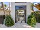 Inviting entryway with unique gate and stone pathway at 512 Bayview Pl, Anna Maria, FL 34216