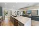 Modern kitchen with an island and a view of the living room at 512 Bayview Pl, Anna Maria, FL 34216