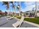 Relaxing patio area with lounge chairs and tropical landscaping at 512 Bayview Pl, Anna Maria, FL 34216