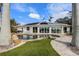 Inviting freeform pool with a large patio and solar panels at 512 Bayview Pl, Anna Maria, FL 34216