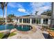 Expansive pool with stonework and a view of the water at 512 Bayview Pl, Anna Maria, FL 34216