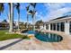 Stunning freeform pool and spa with patio and water views at 512 Bayview Pl, Anna Maria, FL 34216