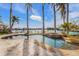 Relaxing freeform pool and spa with a view of the waterway at 512 Bayview Pl, Anna Maria, FL 34216