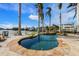 Freeform pool and spa with stone accents and waterfront views at 512 Bayview Pl, Anna Maria, FL 34216