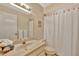 Clean bathroom with shower/tub combo and updated vanity at 5248 Marshfield Ln # 2, Sarasota, FL 34235