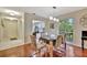 Dining room with hardwood floors and view into kitchen at 5248 Marshfield Ln # 2, Sarasota, FL 34235