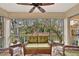 Relaxing screened porch with wicker furniture and tranquil views at 5248 Marshfield Ln # 2, Sarasota, FL 34235