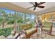 Bright and airy screened porch with view of the bedroom at 5248 Marshfield Ln # 2, Sarasota, FL 34235