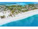 Aerial view of coastline, showing beachfront homes and ocean at 541 Edlee Ln, Longboat Key, FL 34228