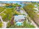 Aerial view of house, pool, and surrounding area at 541 Edlee Ln, Longboat Key, FL 34228