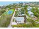 Aerial view showing home, tennis court, and ocean access at 541 Edlee Ln, Longboat Key, FL 34228