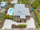 Aerial view of house, pool, landscaping, and driveway at 541 Edlee Ln, Longboat Key, FL 34228