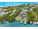 Aerial view of waterfront home with private dock and boats at 541 Edlee Ln, Longboat Key, FL 34228